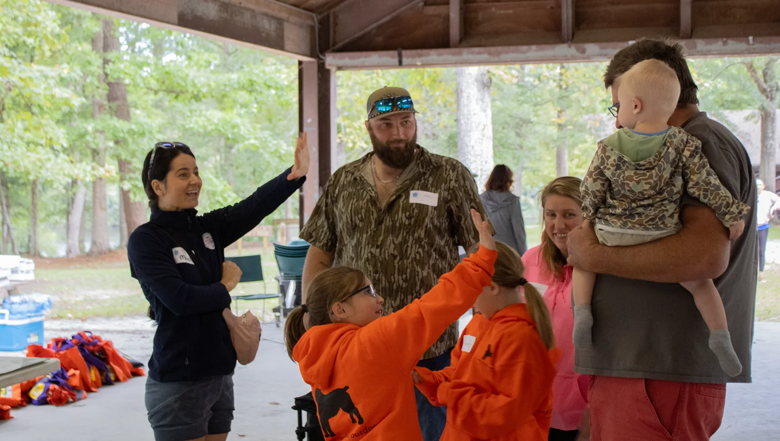 A family arriving at a DFC event