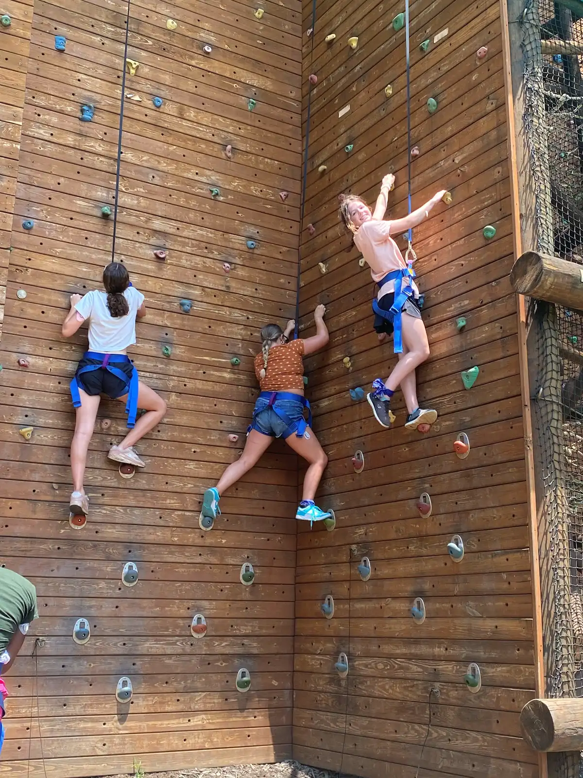 Campers climbing the rock wall at Camp Morris